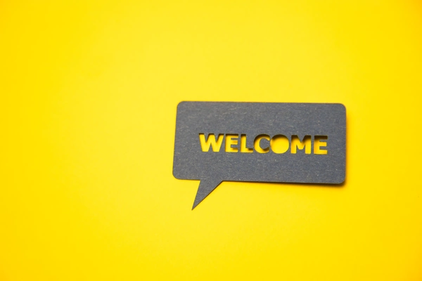 Image of a speech bubble that says Welcome